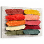 Reihe strukturierter Pinselstriche in Dunkelrot, Rot, Rosa, Creme und Teal als dekoratives Farbmuster